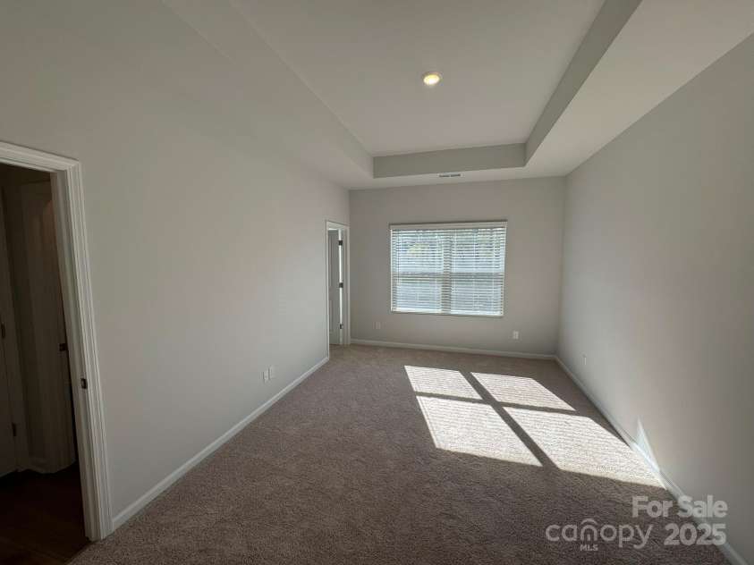 4750 Lakeview Road, Charlotte, NC 28216.  MLS# CAR4261325, YatesRealty ID 2164. Primary Bedroom with 10' boxed tray ceiling