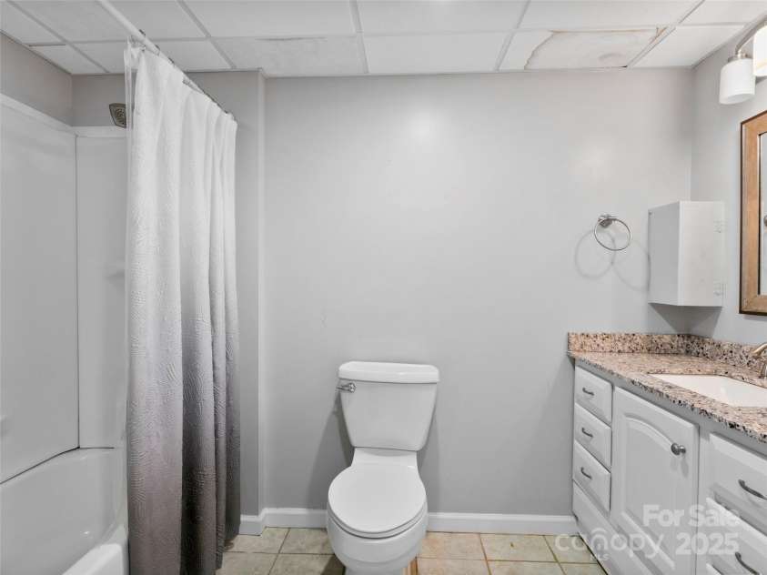 45 Avondale Heights Road, Asheville, NC 28803.  MLS# CAR4270386, YatesRealty ID 21643. Lower level bathroom