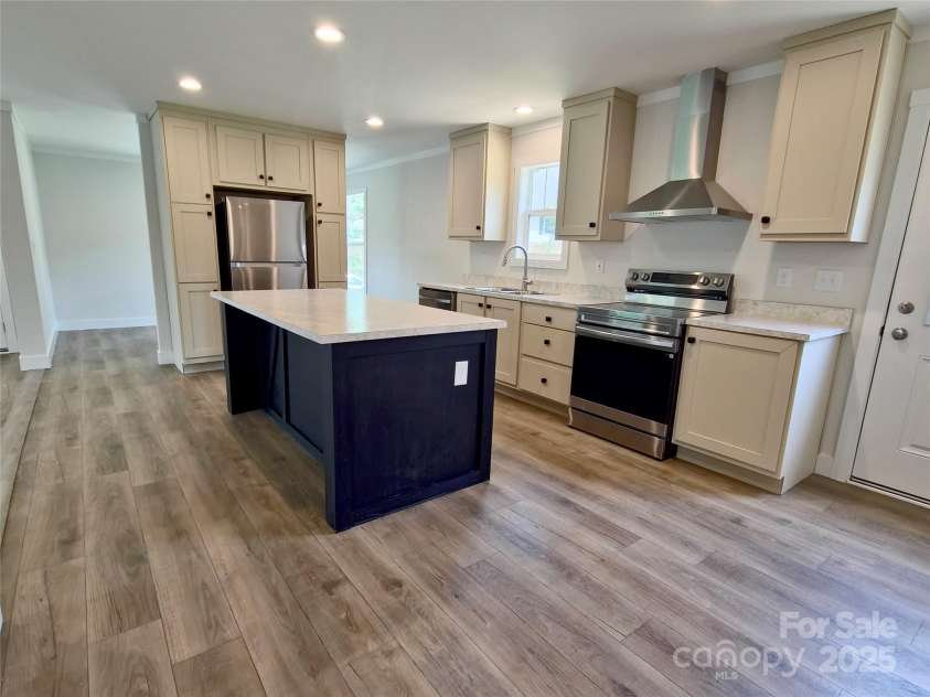 126 Fountain Way, Swannanoa, NC 28778.  MLS# CAR4273601, YatesRealty ID 21647. Kitchen w/ Dining Room beyond