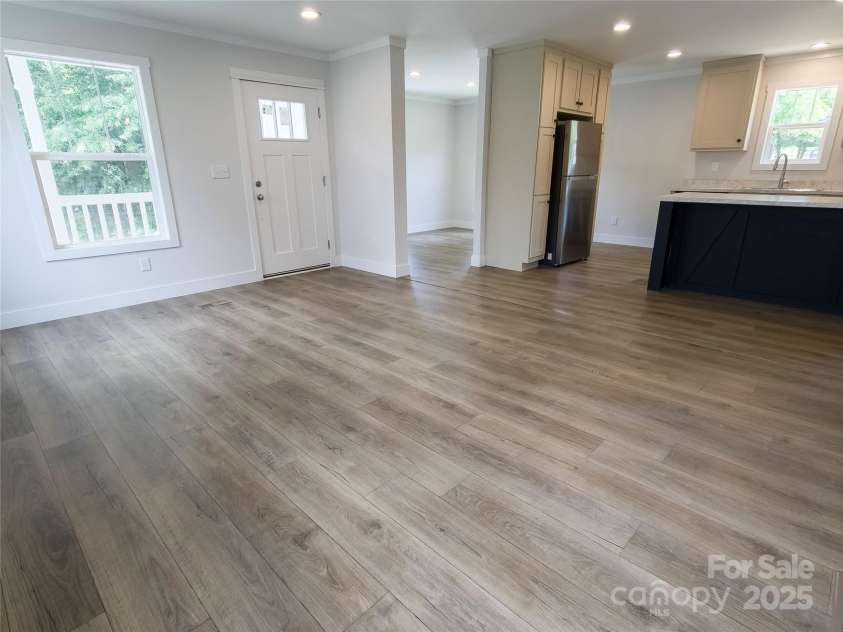 126 Fountain Way, Swannanoa, NC 28778.  MLS# CAR4273601, YatesRealty ID 21647. Living room open to Kitchen and Dining Room