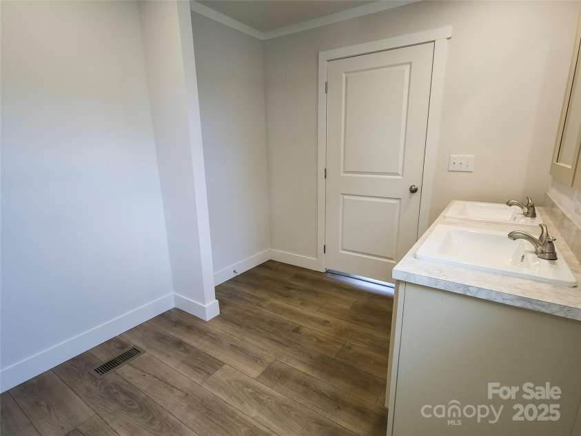 126 Fountain Way, Swannanoa, NC 28778.  MLS# CAR4273601, YatesRealty ID 21647. Space for built in shelving in Primary Bathroom