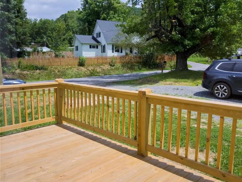 126 Fountain Way, Swannanoa, NC 28778.  MLS# CAR4273601, YatesRealty ID 21647. Sunny deck off the kitchen