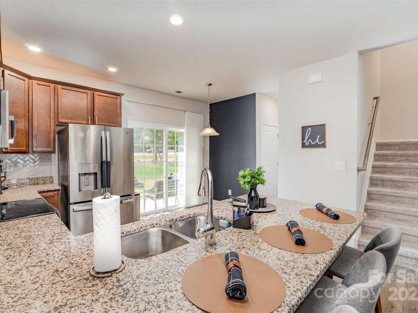 348 Zocalo Drive, Gastonia, NC 28056.  MLS# CAR4306687, YatesRealty ID 21648. Kitchen with tall cabinets and granite tops 