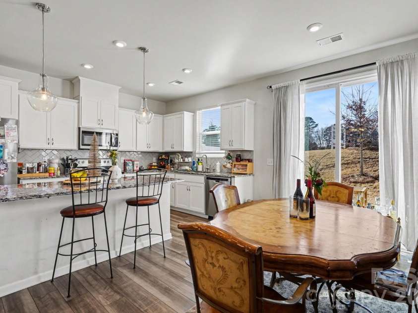 5608 Axil Lane, Charlotte, NC 28269.  MLS# CAR4349614, YatesRealty ID 2165. Dining Room and Kitchen