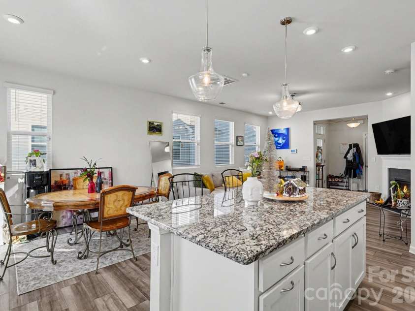 5608 Axil Lane, Charlotte, NC 28269.  MLS# CAR4349614, YatesRealty ID 2165. Kitchen Island and Dining Room 