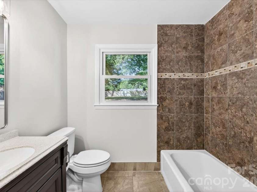 900 John Street, Matthews, NC 28105.  MLS# CAR4370115, YatesRealty ID 21650. 