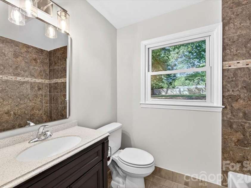 900 John Street, Matthews, NC 28105.  MLS# CAR4370115, YatesRealty ID 21650. 