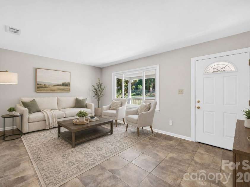 900 John Street, Matthews, NC 28105.  MLS# CAR4370115, YatesRealty ID 21650. Virtually Staged