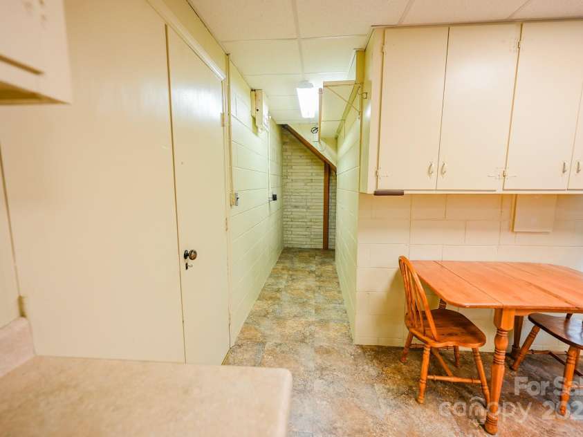 183 Creekside Drive, Forest City, NC 28043.  MLS# CAR4199948, YatesRealty ID 21656. Basement Kitchen