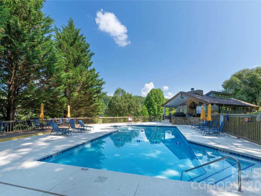 87 Willow Road, Waynesville, NC 28786.  MLS# CAR4421273, YatesRealty ID 2166. Relax by the pool.