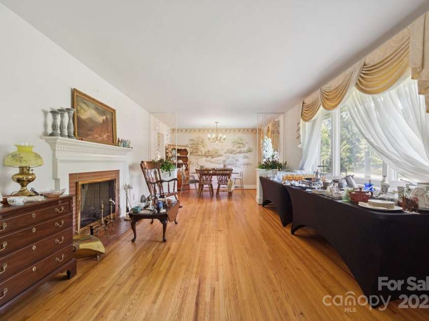 2500 Kendrick Drive, Charlotte, NC 28214.  MLS# CAR4269762, YatesRealty ID 21662. Living room with wood burning fireplace.