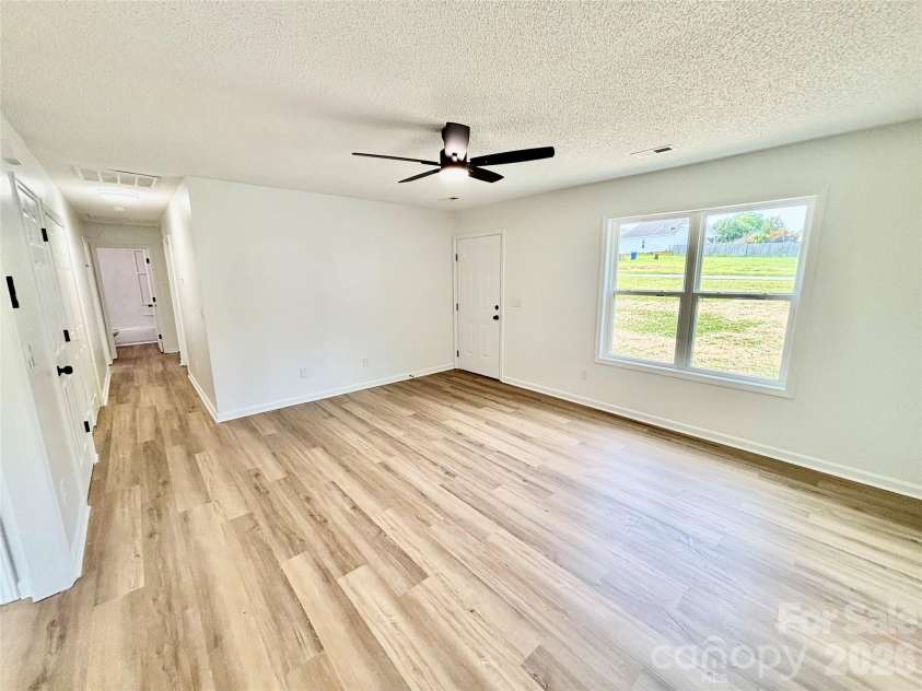 1002 Crescent Way, Wingate, NC 28174.  MLS# CAR4381075, YatesRealty ID 21672. Family Room
