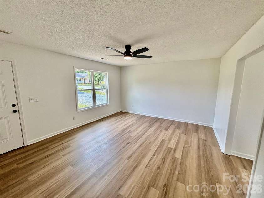 1002 Crescent Way, Wingate, NC 28174.  MLS# CAR4381075, YatesRealty ID 21672. Family Room