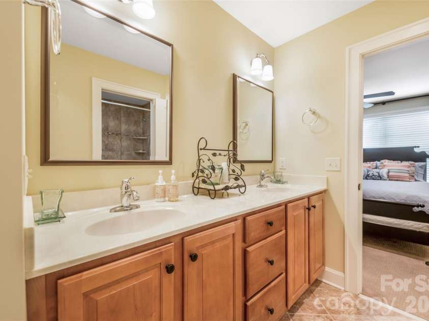 50 Meadow Village Lane, Asheville, NC 28803.  MLS# CAR4380111, YatesRealty ID 21677. Shared bath features a double vanity.