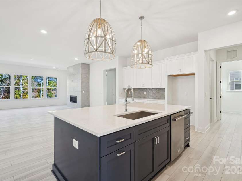 5233 Glenwalk Drive, Charlotte, NC 28269.  MLS# CAR4223508, YatesRealty ID 2168. Representative photo - Eden kitchen and great room