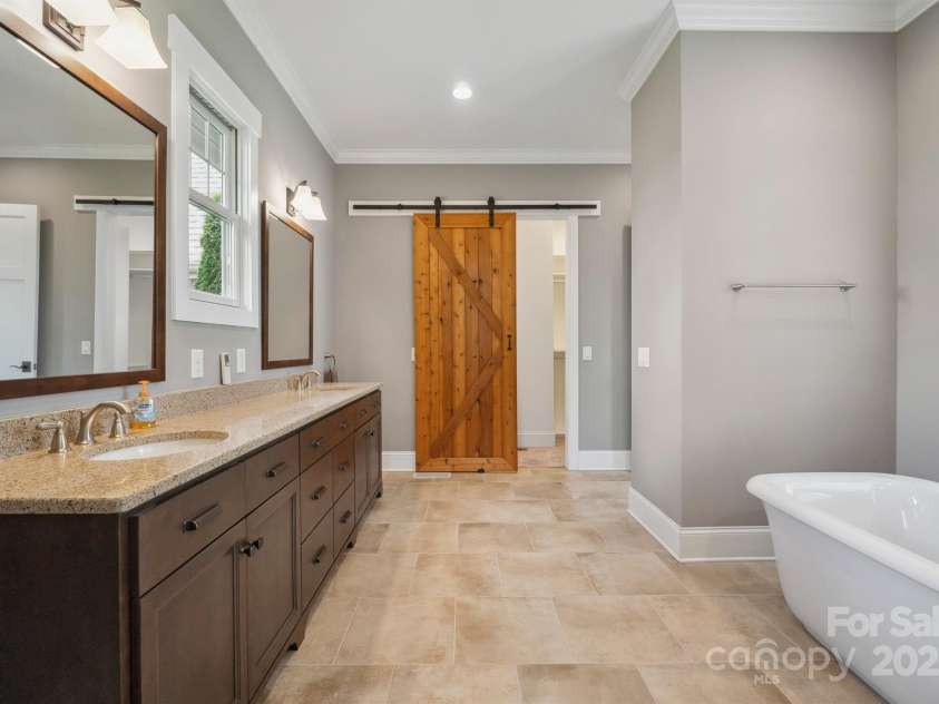 8825 Harris Road, Concord, NC 28027.  MLS# CAR4257660, YatesRealty ID 21683. Barn door to enclose your walk in closet