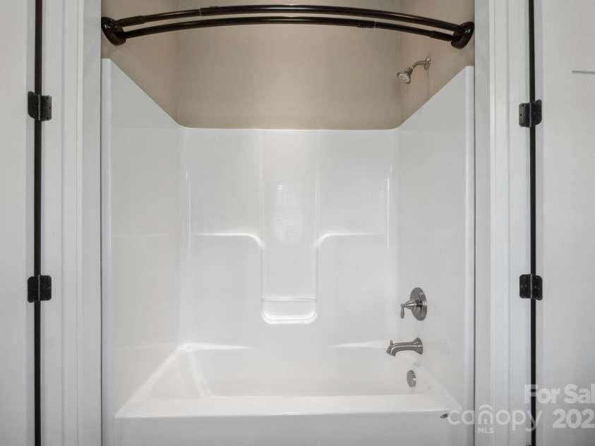 8825 Harris Road, Concord, NC 28027.  MLS# CAR4257660, YatesRealty ID 21683. Shared tub and shower for BR 2 and 3