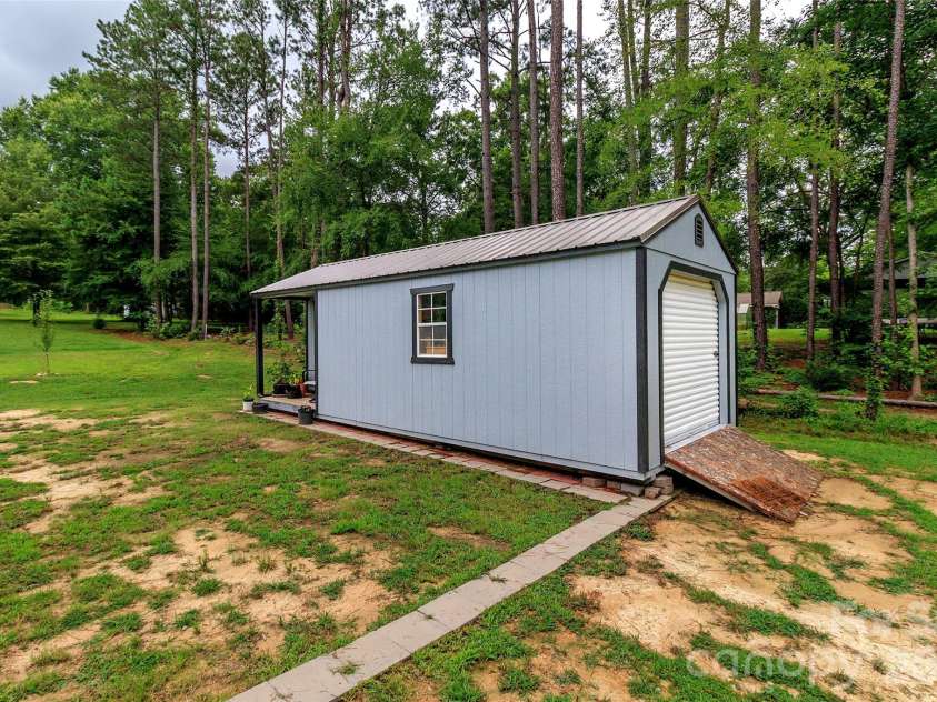 900 Providence Road, Lancaster, SC 29720.  MLS# CAR4380593, YatesRealty ID 21692. Walkway to storage shed