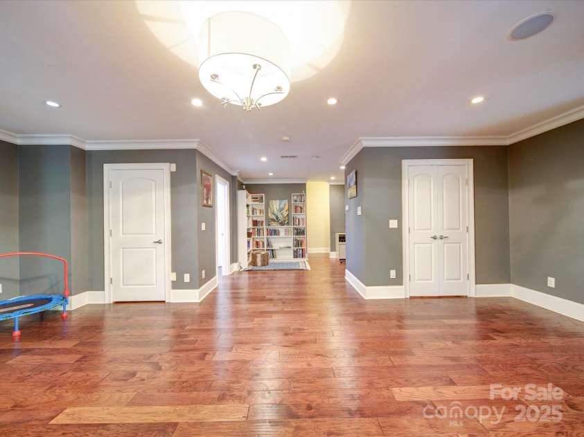 120 Shadow Ridge Court, Statesville, NC 28677.  MLS# CAR4237672, YatesRealty ID 21699. Basement w/ Wide Plank Hardwoods