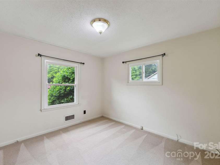 46 Donna Dale Avenue, Concord, NC 28025.  MLS# CAR4268171, YatesRealty ID 21700. Bedroom #2 at front corner over looking front yard