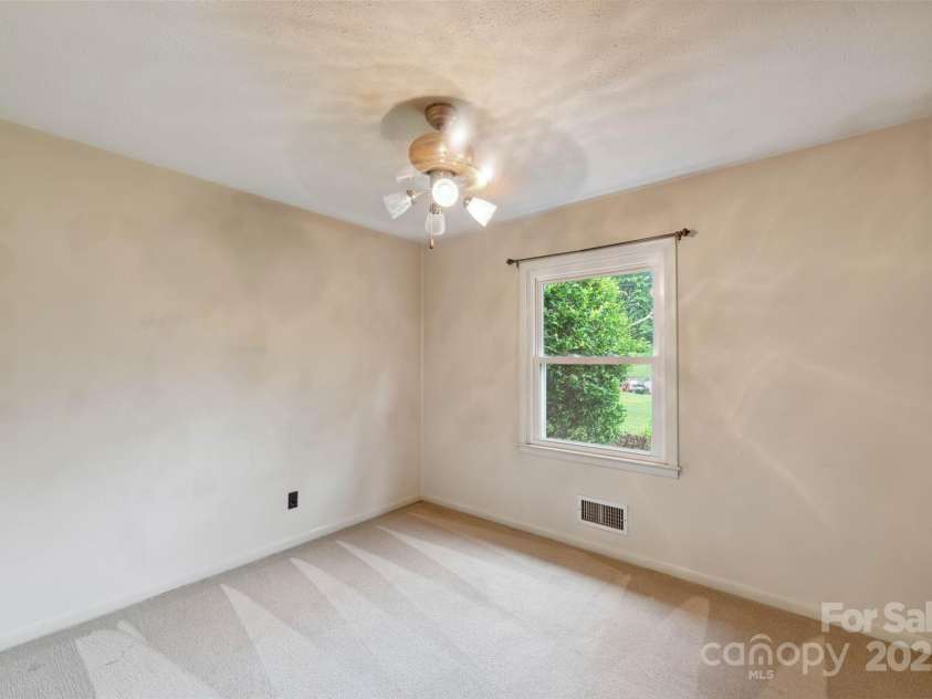 46 Donna Dale Avenue, Concord, NC 28025.  MLS# CAR4268171, YatesRealty ID 21700. Bedroom #3 looks out to the front yard.