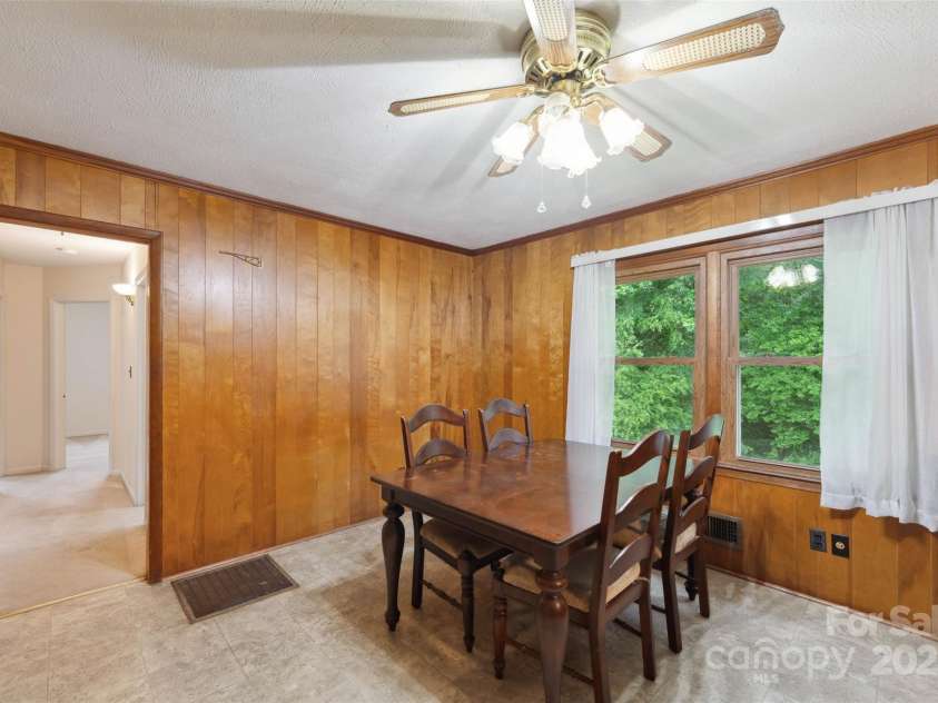 46 Donna Dale Avenue, Concord, NC 28025.  MLS# CAR4268171, YatesRealty ID 21700. Dining area with window over looking the back yard and show casing the hallway to the bedrooms.