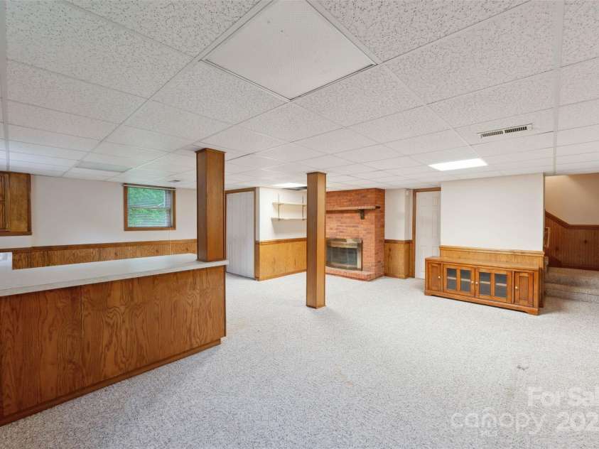 46 Donna Dale Avenue, Concord, NC 28025.  MLS# CAR4268171, YatesRealty ID 21700. Finished basement view from basement door to the back yard