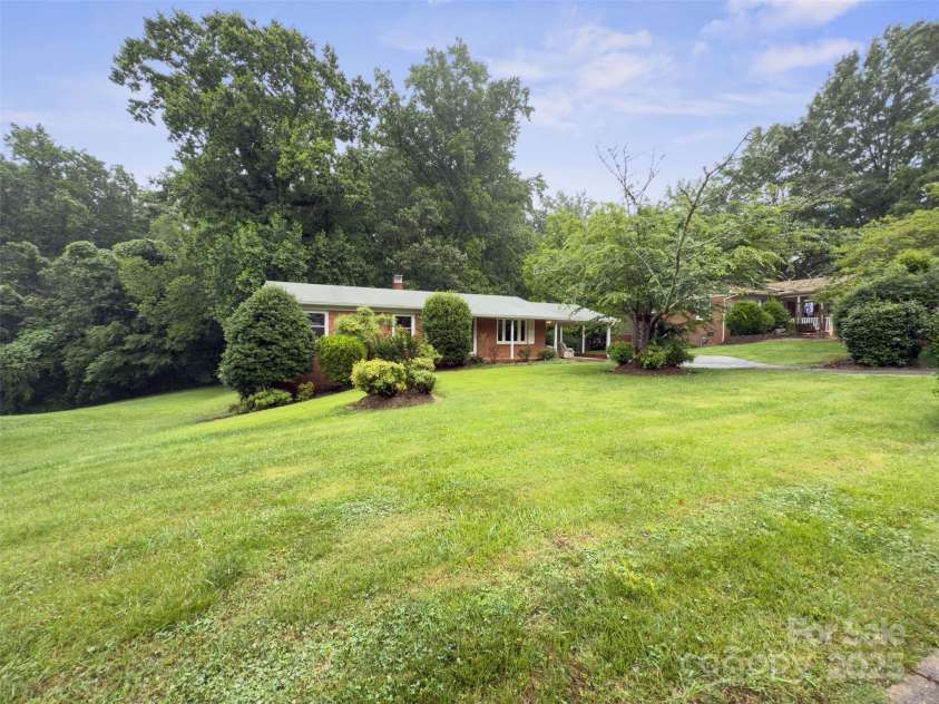 46 Donna Dale Avenue, Concord, NC 28025.  MLS# CAR4268171, YatesRealty ID 21700. Front and side yard view