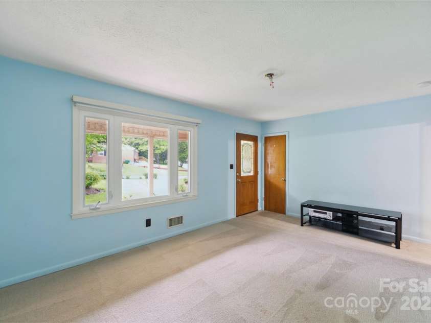 46 Donna Dale Avenue, Concord, NC 28025.  MLS# CAR4268171, YatesRealty ID 21700. Living room show casing the large picture window