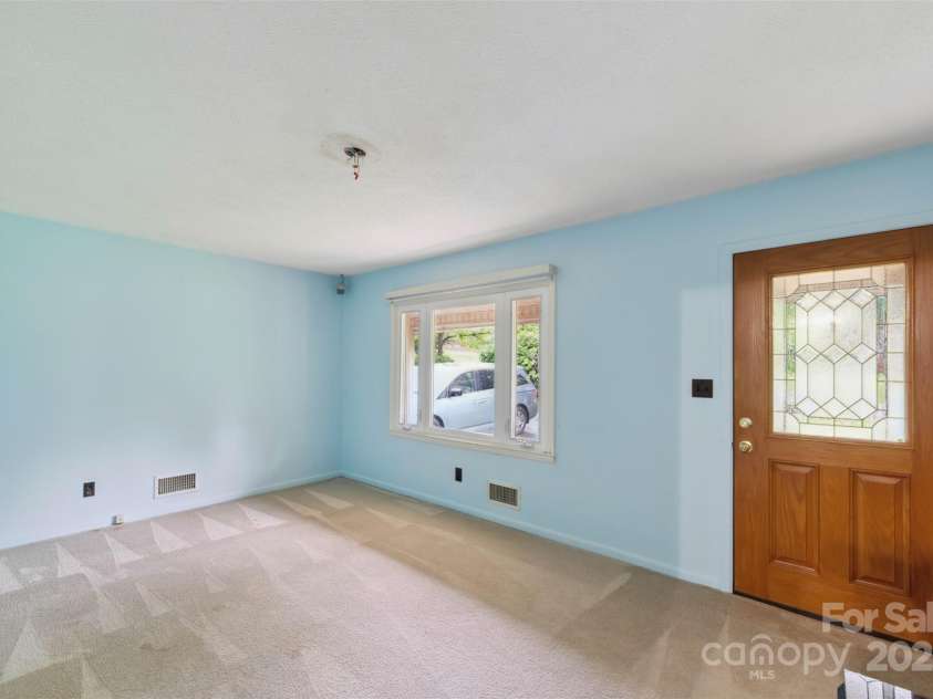 46 Donna Dale Avenue, Concord, NC 28025.  MLS# CAR4268171, YatesRealty ID 21700. Living room view from the kitchen