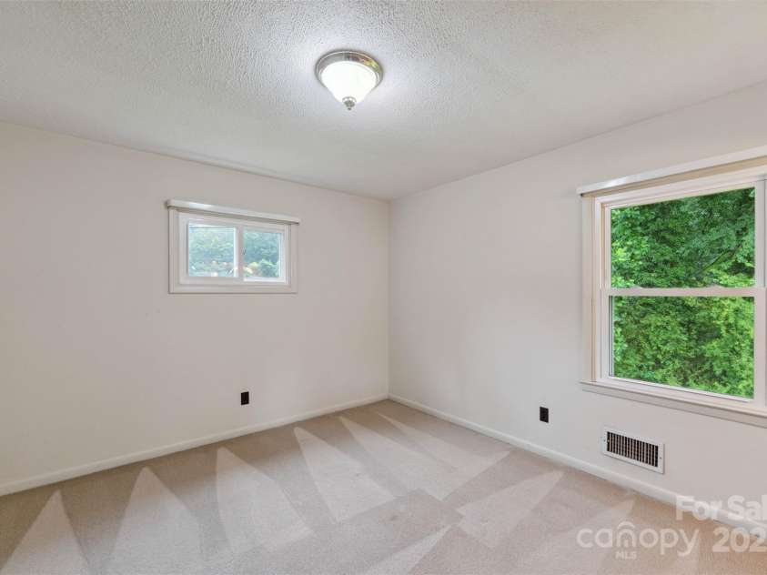 46 Donna Dale Avenue, Concord, NC 28025.  MLS# CAR4268171, YatesRealty ID 21700. Primary bedroom at the back corner over looking the back yard