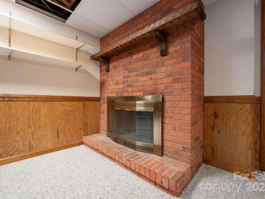 46 Donna Dale Avenue, Concord, NC 28025.  MLS# CAR4268171, YatesRealty ID 21700. Wood burning fireplace in the basement