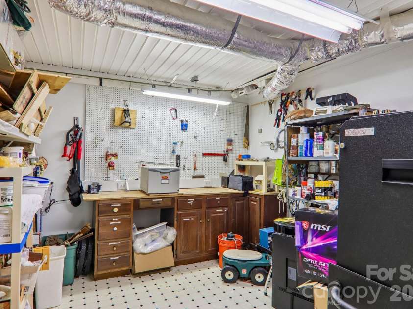 104 Finley Street, Hendersonville, NC 28739.  MLS# CAR4380496, YatesRealty ID 21711. Lower level workshop