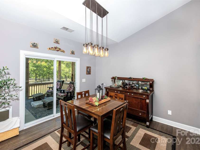 340 Hound Hollow Road, Camden, SC 29020.  MLS# CAR4240958, YatesRealty ID 21717. Dining Area Leading to Screened Porch