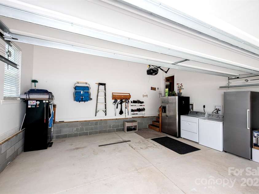 340 Hound Hollow Road, Camden, SC 29020.  MLS# CAR4240958, YatesRealty ID 21717. Oversized Attached Garage with Screen Pull Down Door