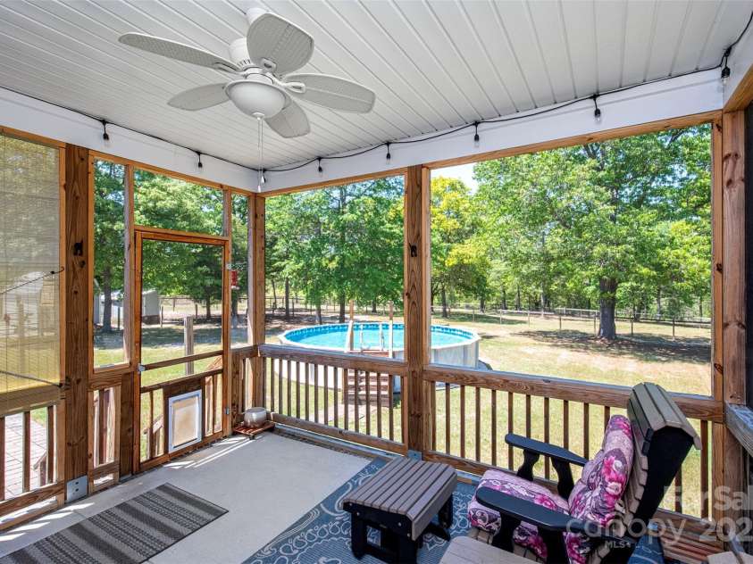 340 Hound Hollow Road, Camden, SC 29020.  MLS# CAR4240958, YatesRealty ID 21717. Screened Porch for Relaxing