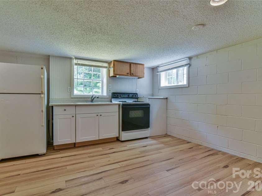 101 Skyland Circle, Asheville, NC 28804.  MLS# CAR4381917, YatesRealty ID 21725. Basement Kitchen