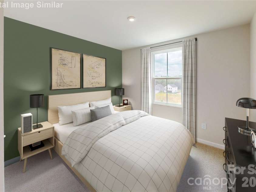 1330 Elm Forest Lane, China Grove, NC 28023.  MLS# CAR4385552, YatesRealty ID 21726. This spacious guest bedroom is ready to impress! Easily fits two nightstands with room to spare, while a large window fills the space with natural light. It’s a blank canvas waiting for your personal touch—cozy, bri