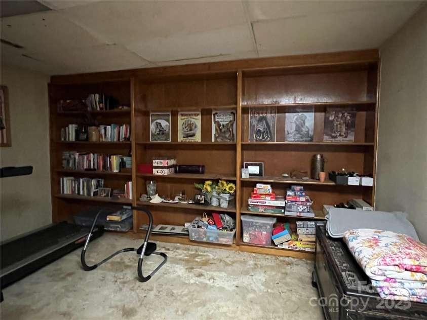 33611 Mann Road, Albemarle, NC 28001.  MLS# CAR4247905, YatesRealty ID 21759. Basement built in bookcase