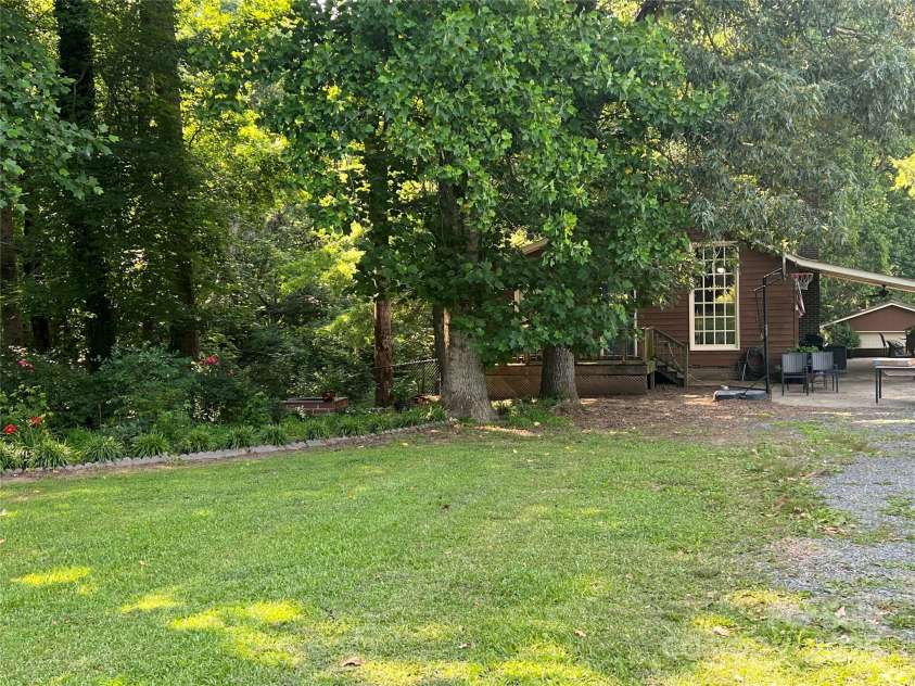 33611 Mann Road, Albemarle, NC 28001.  MLS# CAR4247905, YatesRealty ID 21759. Front of house with carport