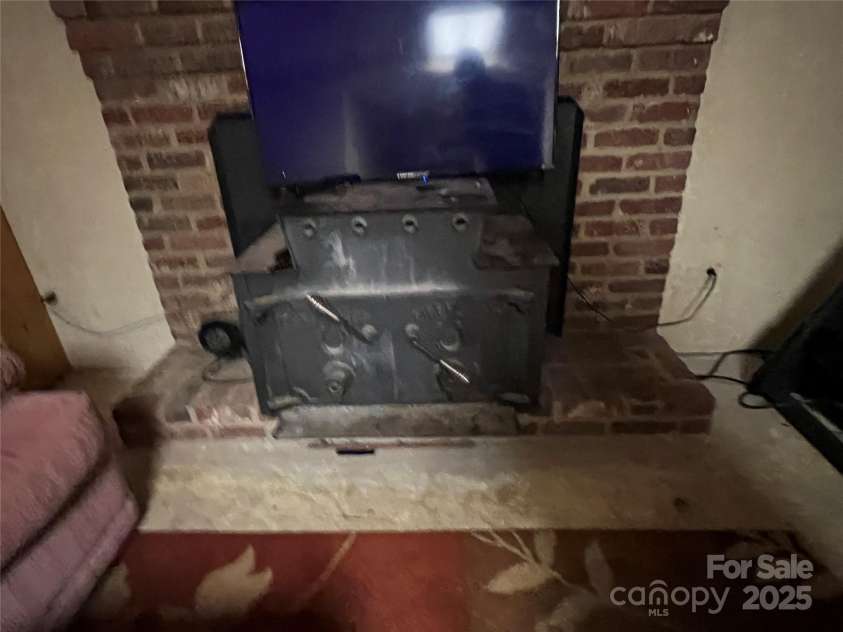 33611 Mann Road, Albemarle, NC 28001.  MLS# CAR4247905, YatesRealty ID 21759. Wood burning stove