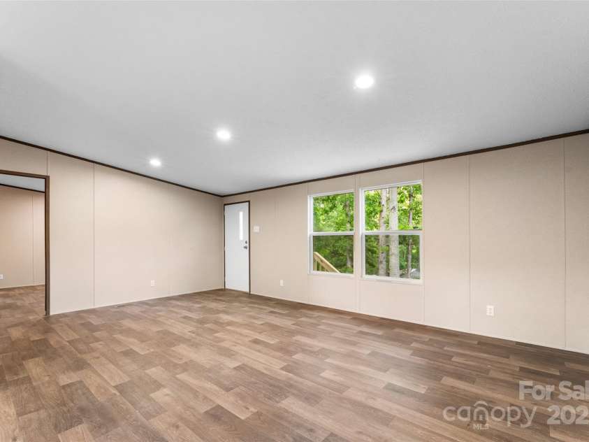99 Sandy Hill Lane, Hendersonville, NC 28792.  MLS# CAR4261406, YatesRealty ID 21760. Family Room