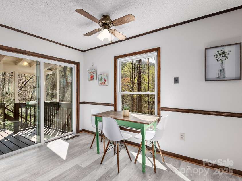 1469 Old Fort Road, Fairview, NC 28730.  MLS# CAR4240790, YatesRealty ID 21774. Covered patio off of kitchen with solid wood trim and baseboards
