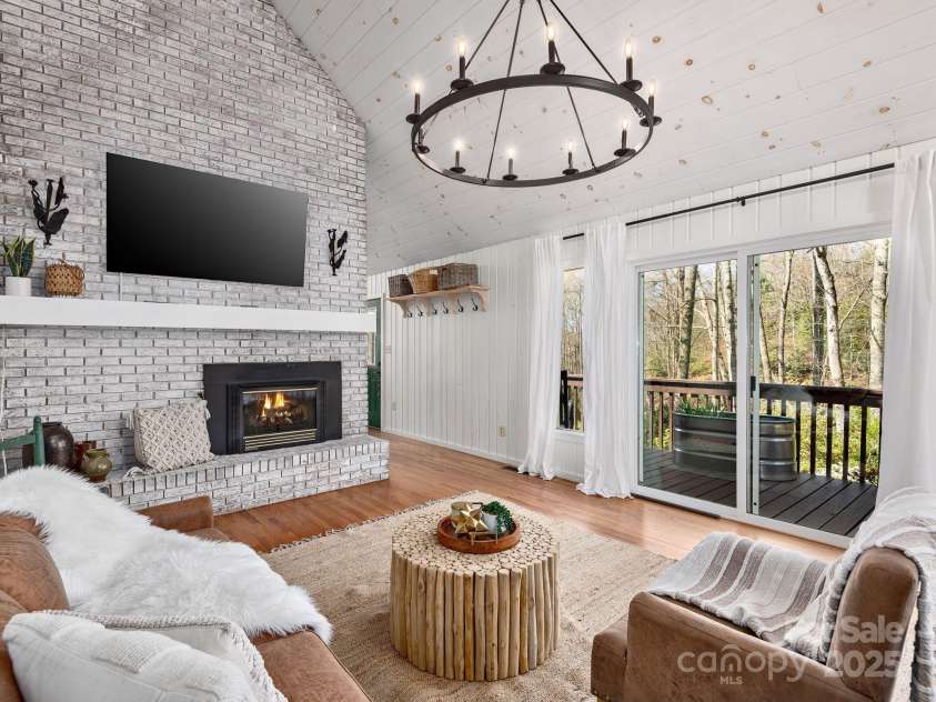 1469 Old Fort Road, Fairview, NC 28730.  MLS# CAR4240790, YatesRealty ID 21774. Mature native plants and flowers surround the deck and covered patio area to enjoy the outdoors in all weather