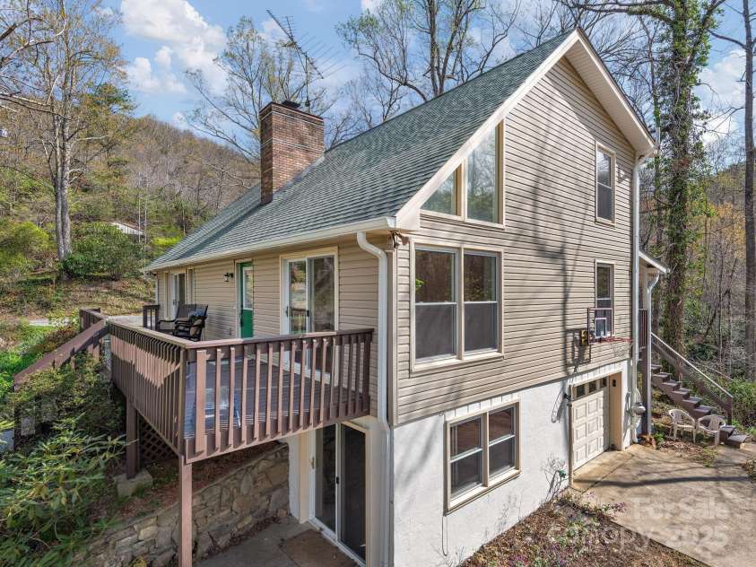1469 Old Fort Road, Fairview, NC 28730.  MLS# CAR4240790, YatesRealty ID 21774. Perfect mountain perch with large sun-filled windows, spacious patio, and level driveway with one-car garage