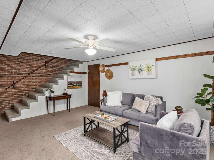 1469 Old Fort Road, Fairview, NC 28730.  MLS# CAR4240790, YatesRealty ID 21774. Spacious lower level living area with direct access to garage