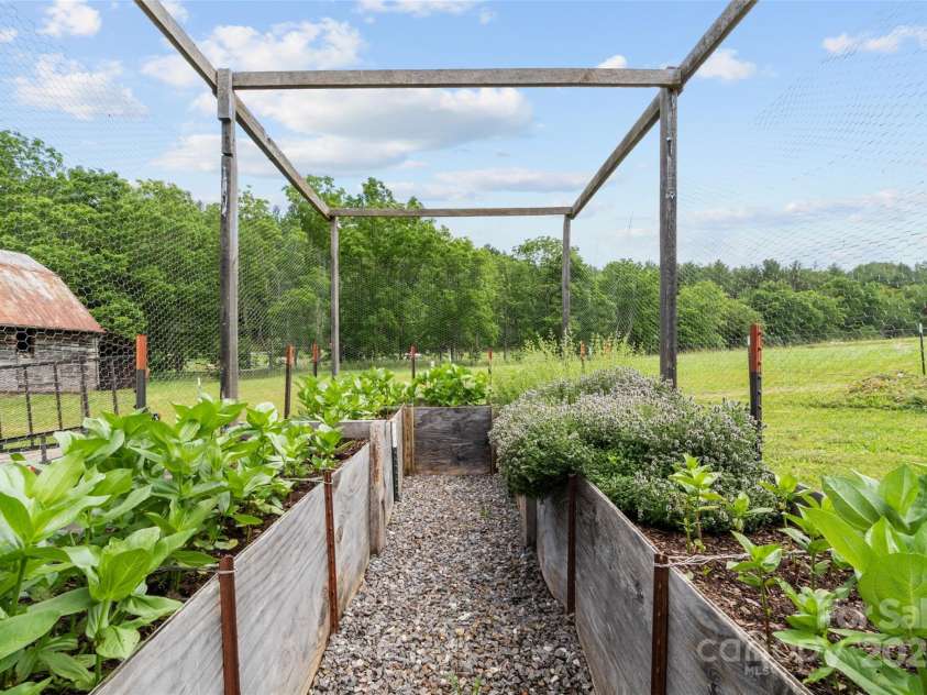 971 Banks Creek Road, Burnsville, NC 28714.  MLS# CAR4270100, YatesRealty ID 21780. A dedicated, fenced garden space offers the perfect spot for growing herbs or flowers—safeguarded from deer and other animals.