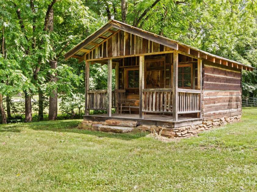 971 Banks Creek Road, Burnsville, NC 28714.  MLS# CAR4270100, YatesRealty ID 21780. An authentic log cabin from the original owners remains on the property—a true testament to its heritage