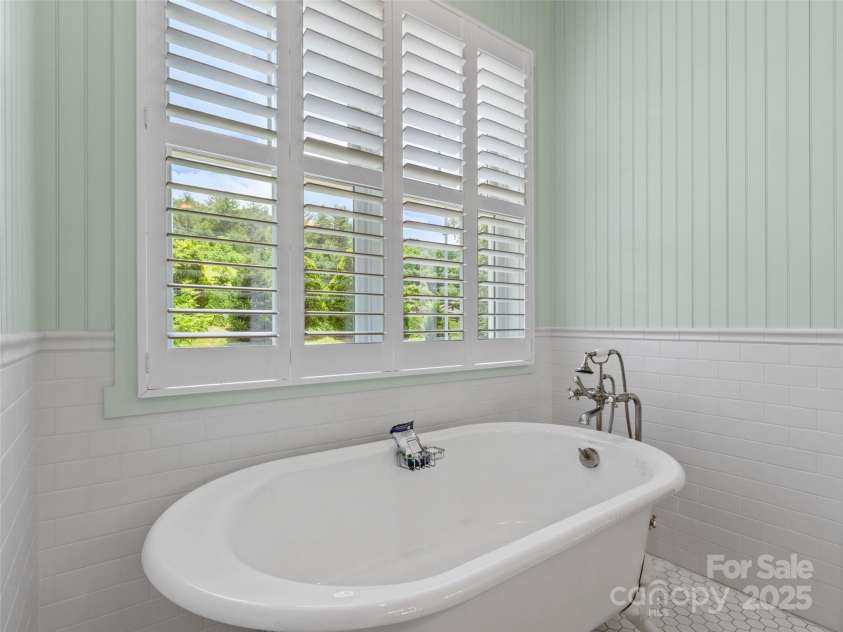 971 Banks Creek Road, Burnsville, NC 28714.  MLS# CAR4270100, YatesRealty ID 21780. Clawfoot tub perfectly positioned to capture more breathtaking scenery.