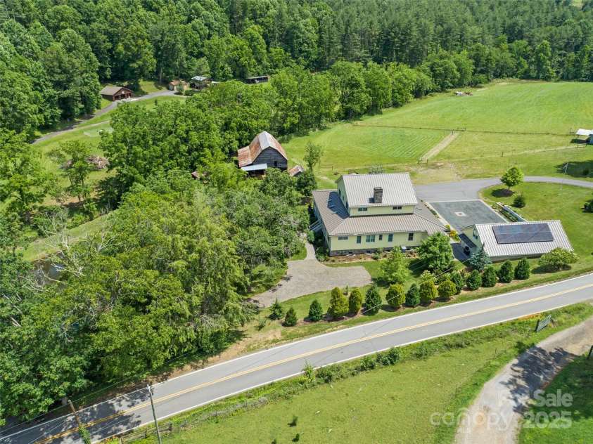 971 Banks Creek Road, Burnsville, NC 28714.  MLS# CAR4270100, YatesRealty ID 21780. Conveniently located near the main road, but tucked away behind a natural tree buffer that provides seclusion and quiet